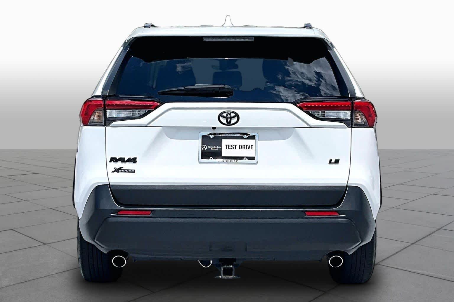 Used 2021 Super White Toyota LE image 5