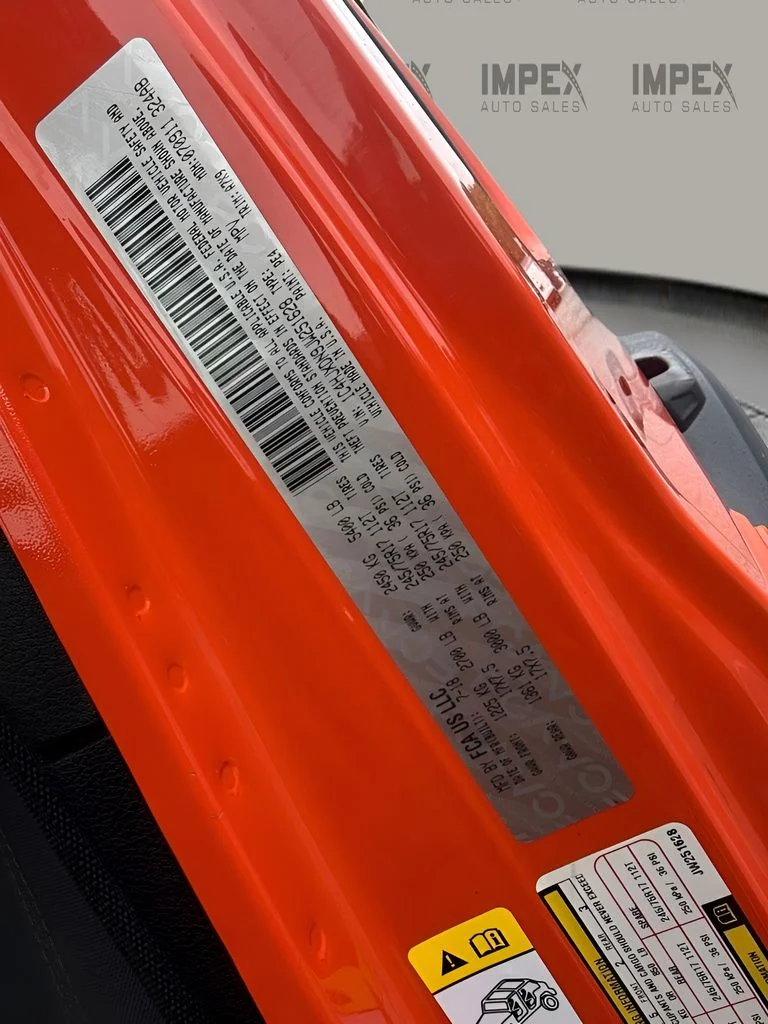 Used 2018 Orange Jeep Unlimited Sport S image 22