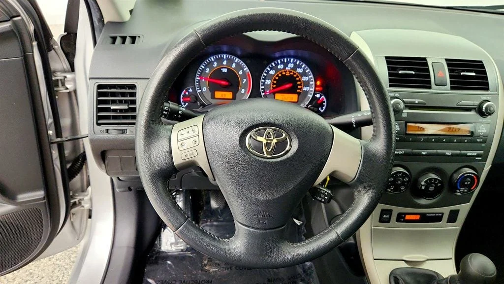 Used 2010 Classic Silver Metallic Toyota 4dr Sedan Manual S w/ Power Moonroof & 16