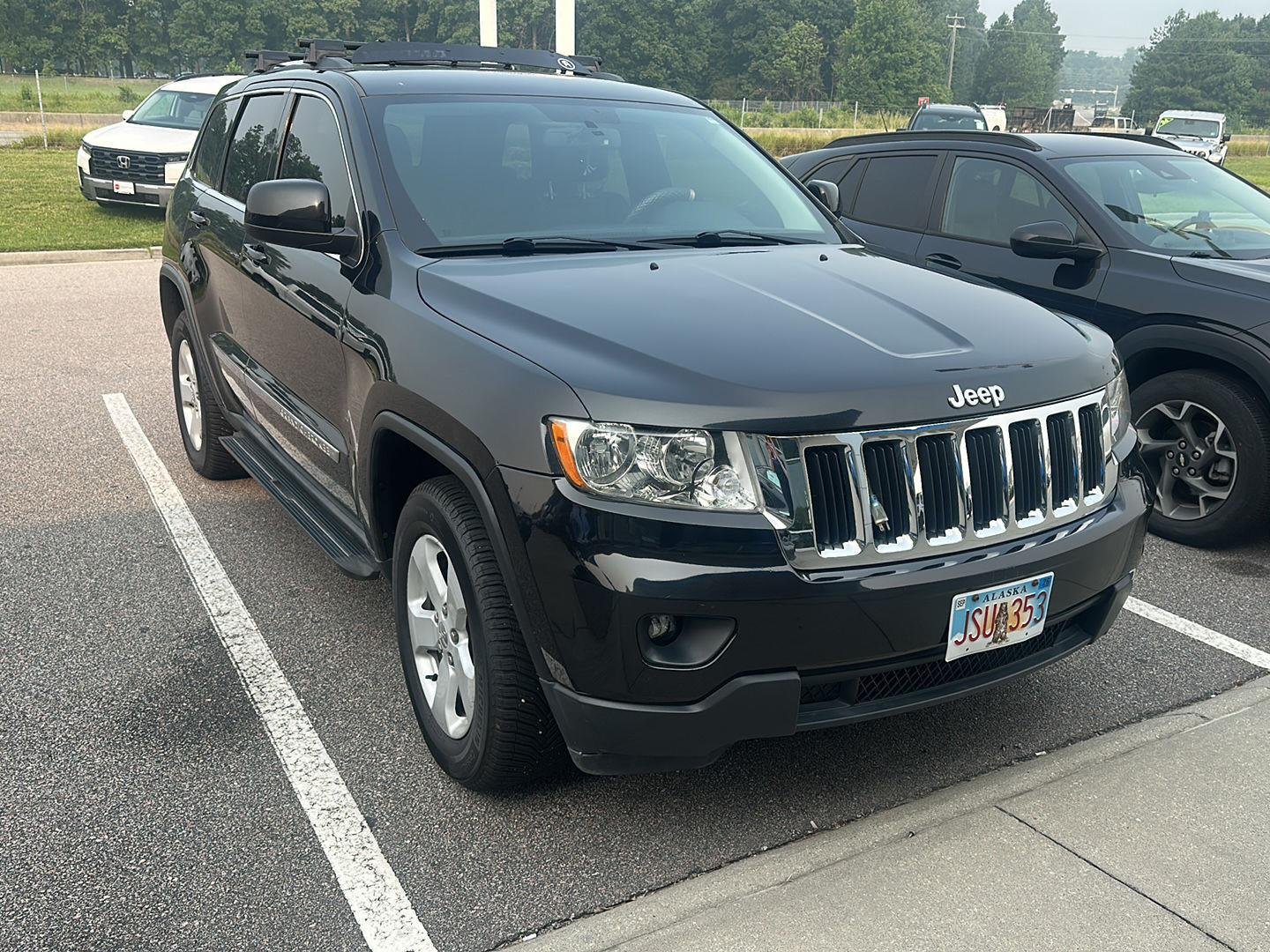Used 2011 Brilliant Black Crystal Pearl Jeep Laredo image 2