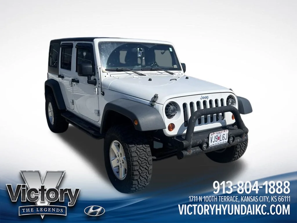 Used 2013 White Jeep Unlimited Sport image 3