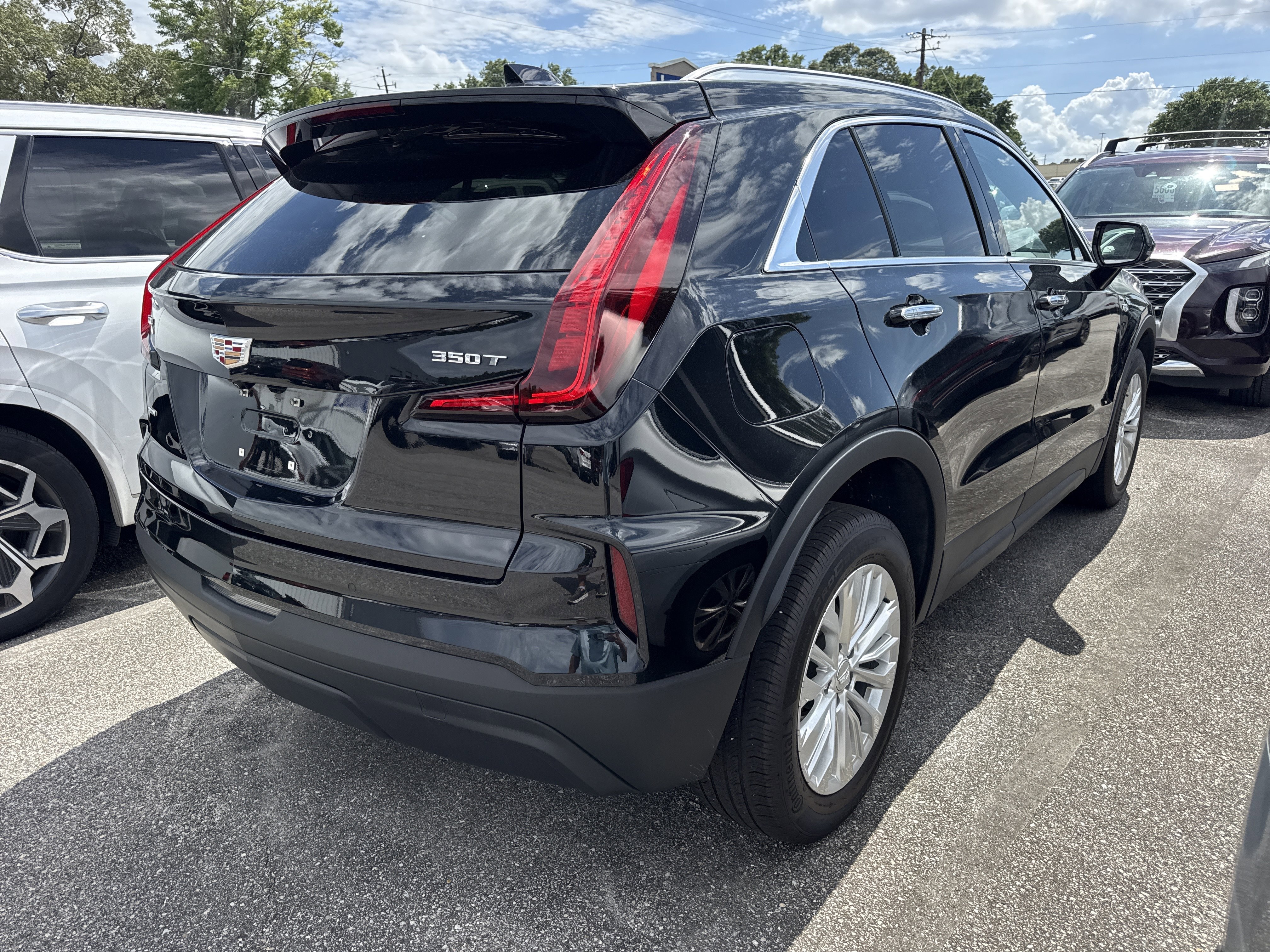 Used 2024 Stellar Black Metallic Cadillac AWD Luxury image 2