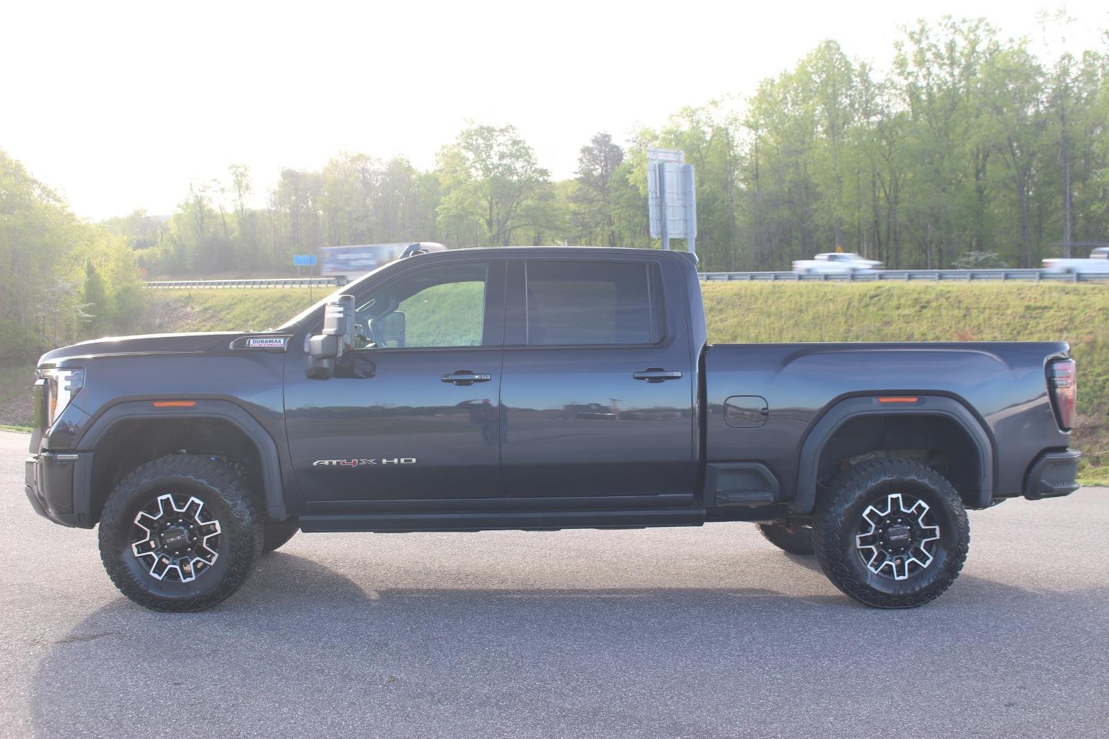 Used 2024 Titanium Rush Metallic GMC AT4X image 4