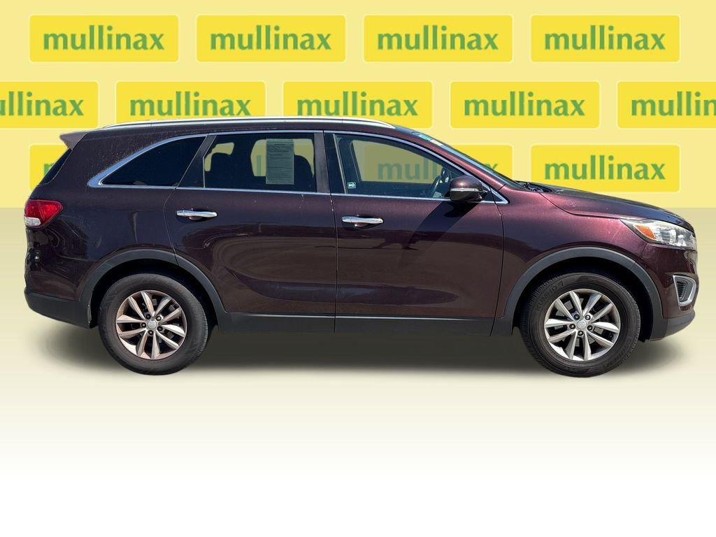 Used 2016 Kia Sorento LX with VIN 5XYPG4A37GG082291 for sale in New Smyrna Beach, FL