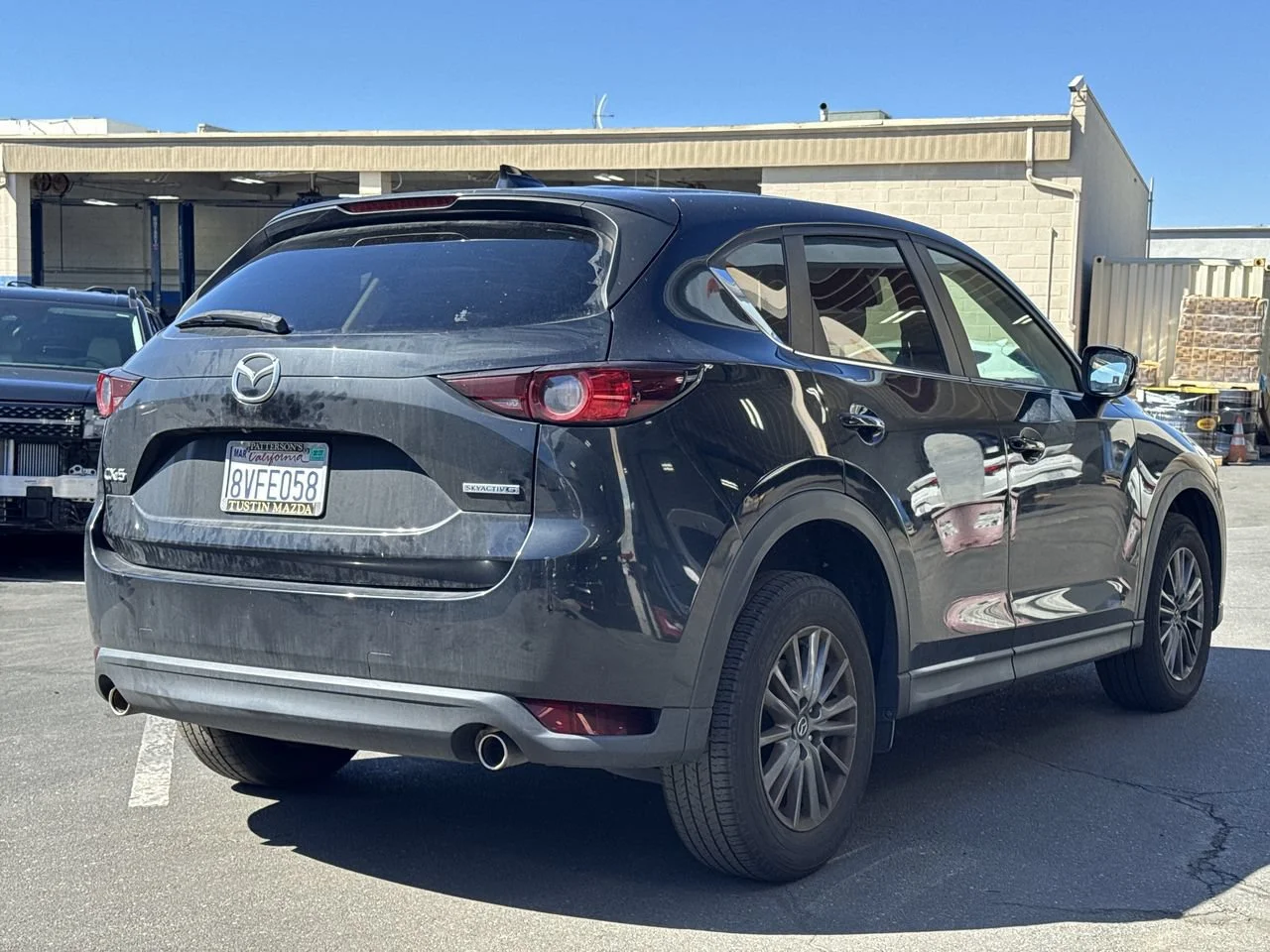 Used 2021 JET BLACK MICA MAZDA TOURING image 4