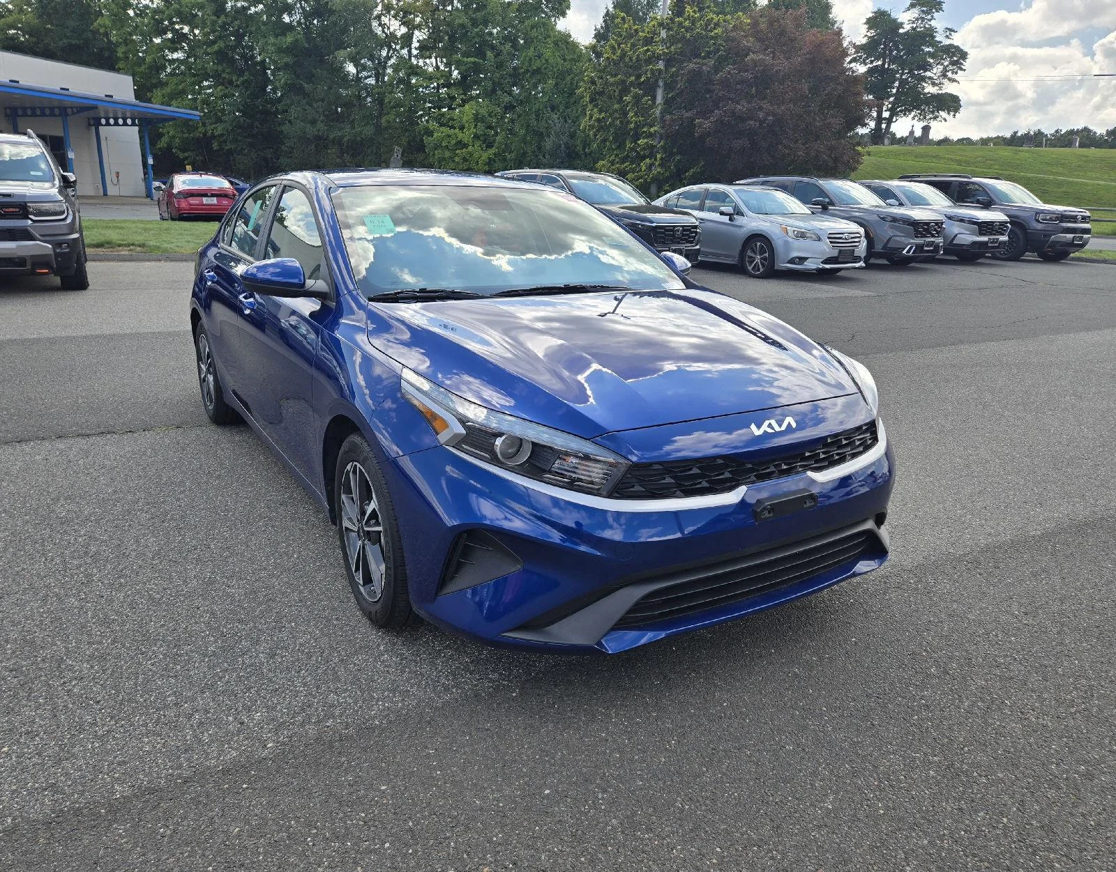 Used 2024 Deep Sea Blue Kia LXS image 1
