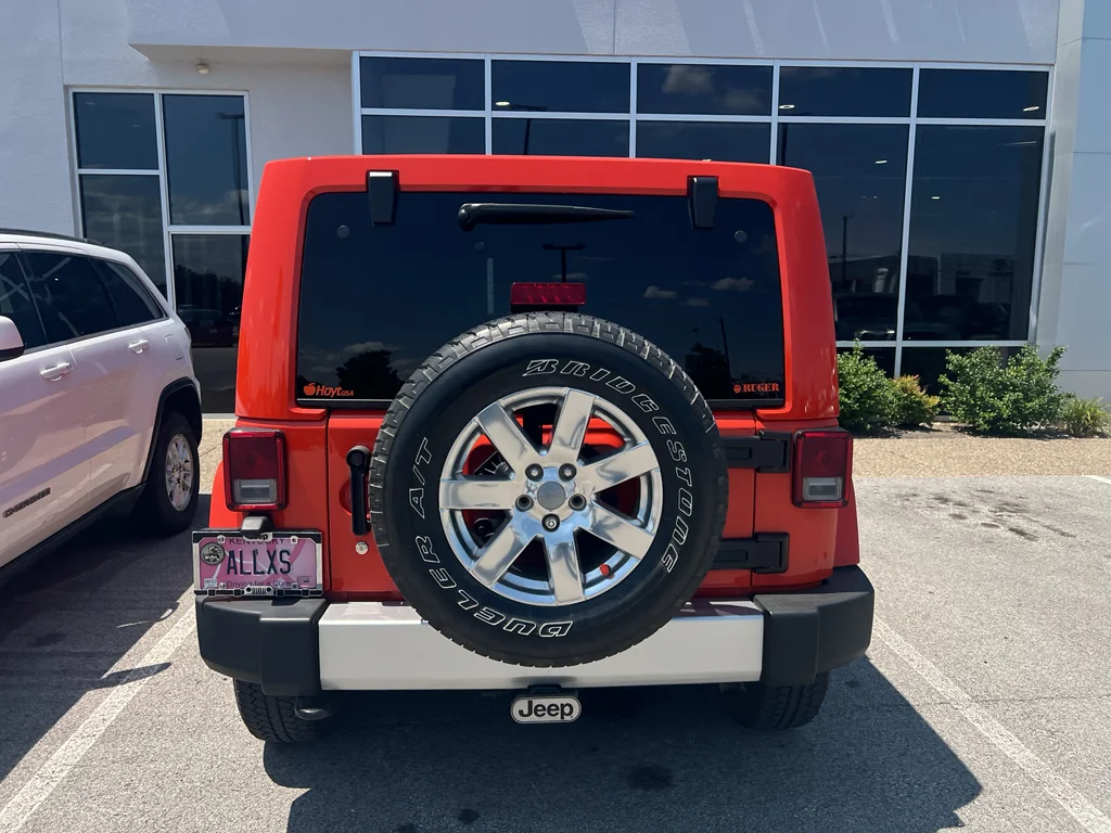 Used 2015 Sunset Orange Pearlcoat Jeep Sahara image 6