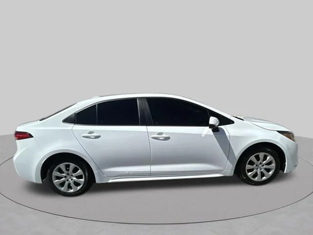 Used 2021 Super White Toyota LE image 6