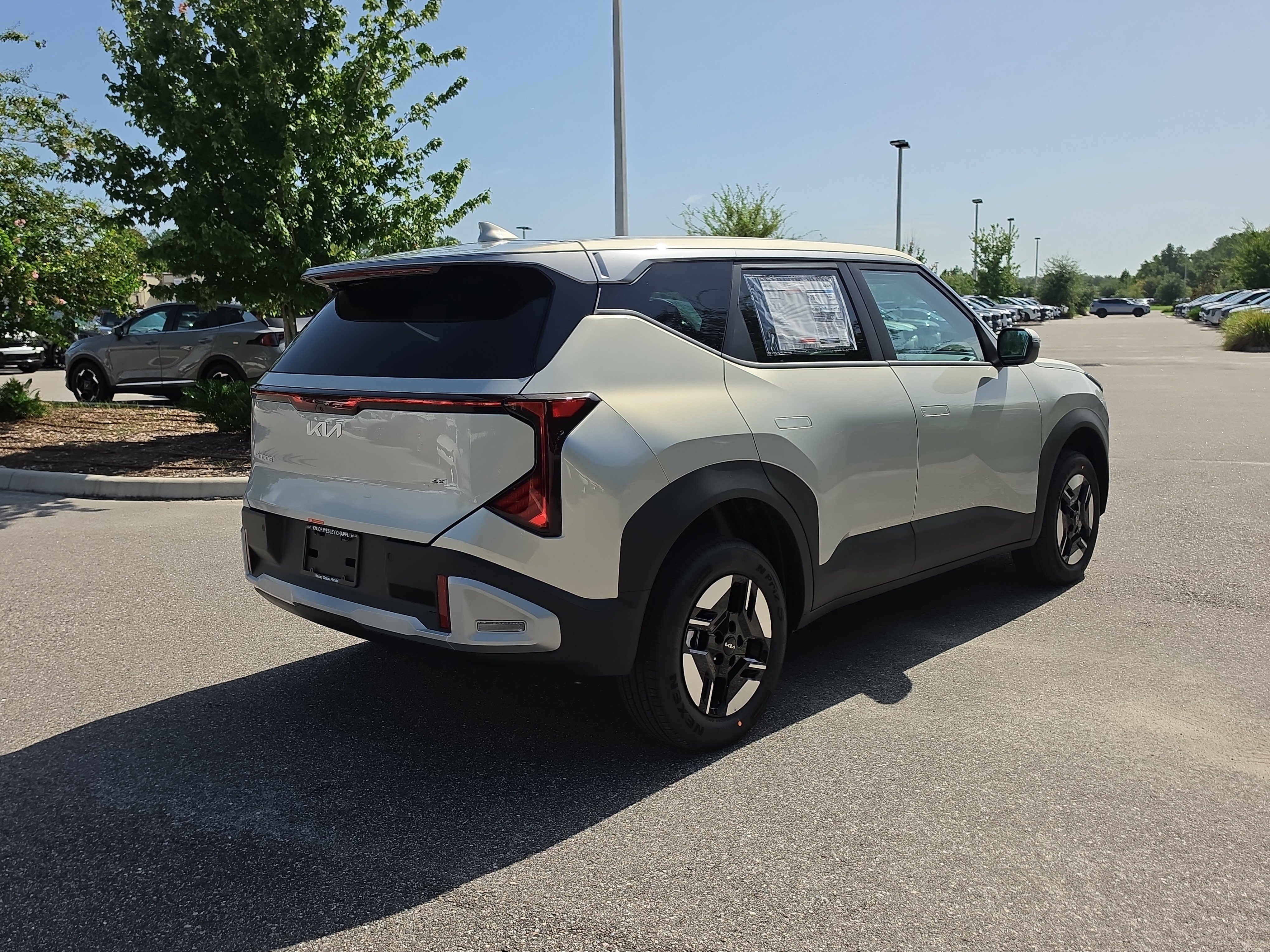 New 2027 Ivory Silver Kia LX image 8