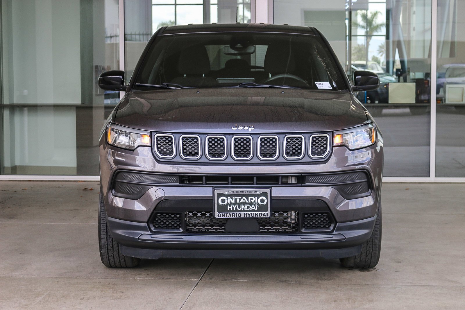 Used 2023 Granite Crystal Metallic Clearcoat Jeep Sport image 3