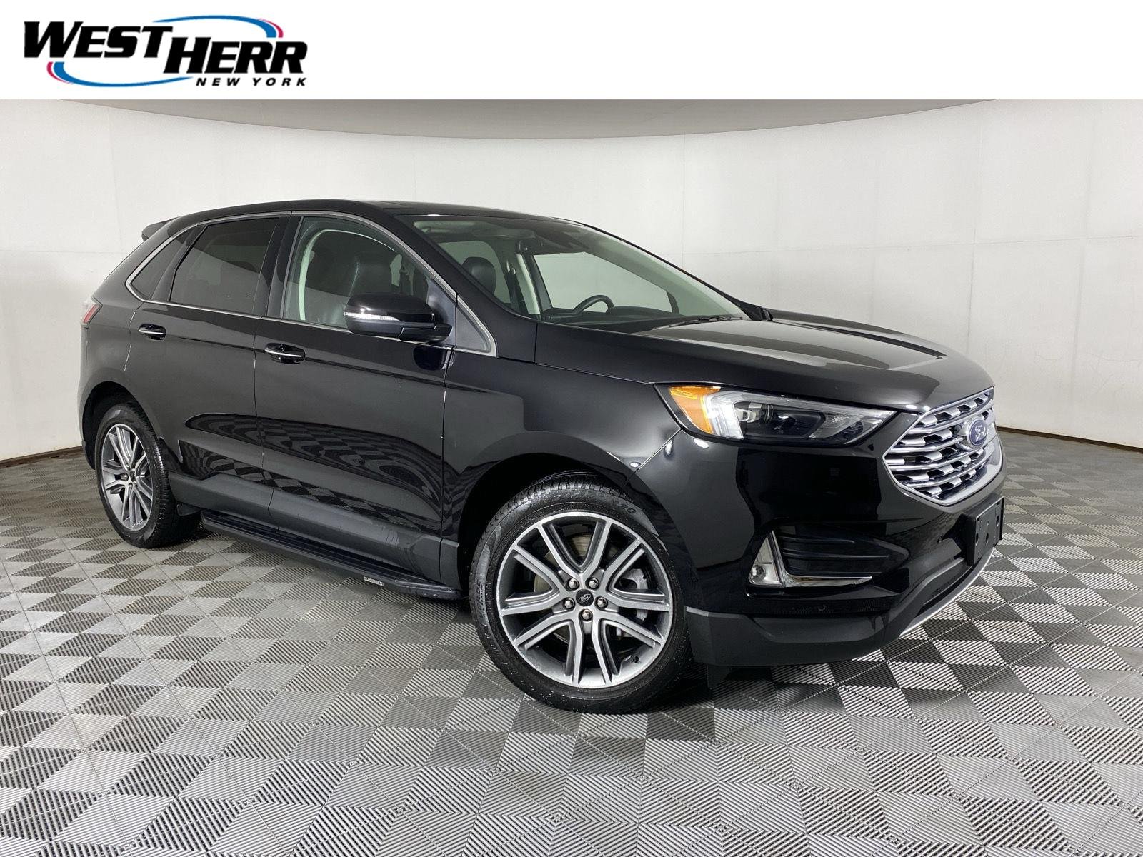 Used 2024 Agate Black Ford Titanium image 1