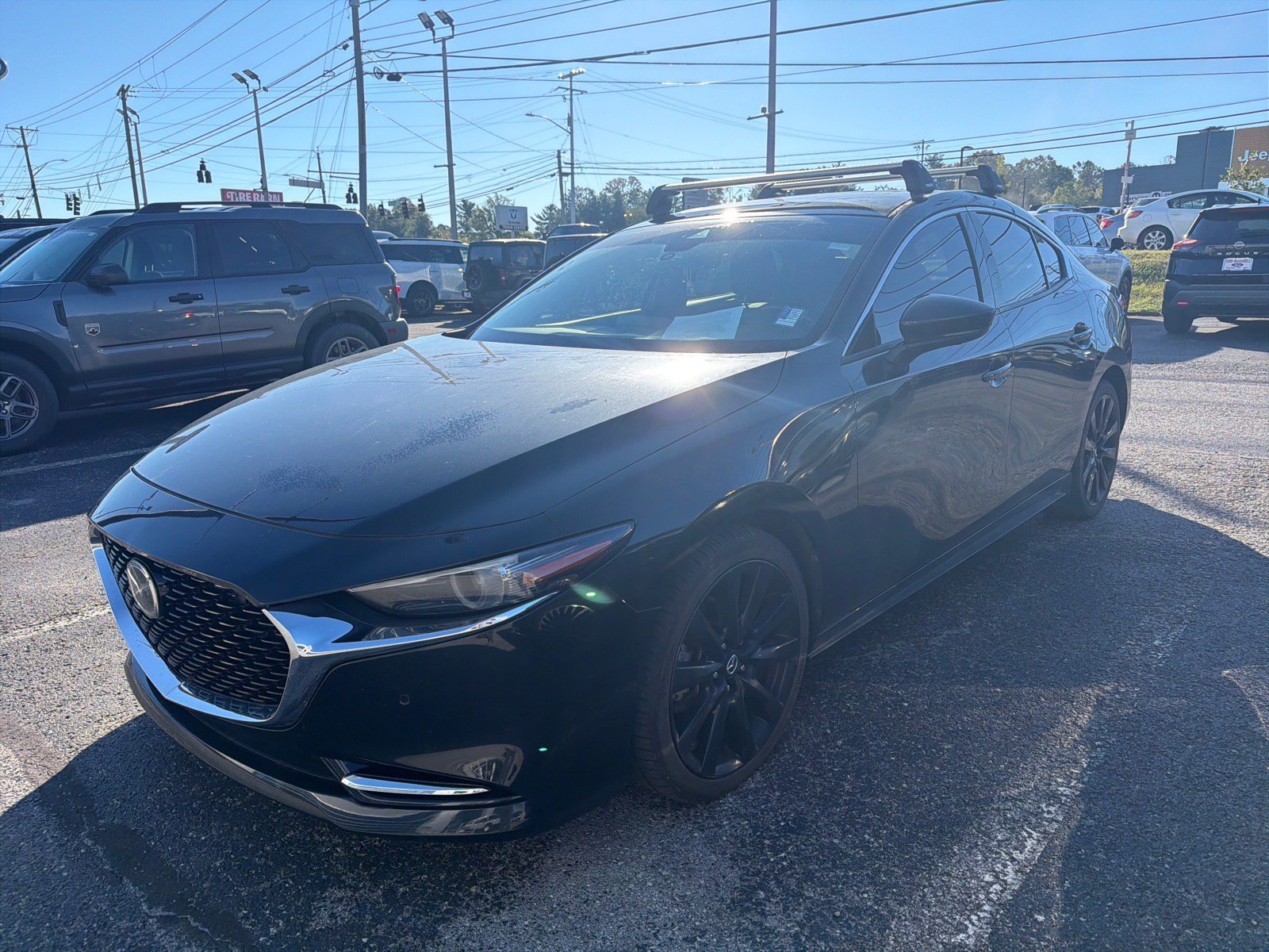 Used 2021 Jet Black Mica Mazda Premium Plus image 1