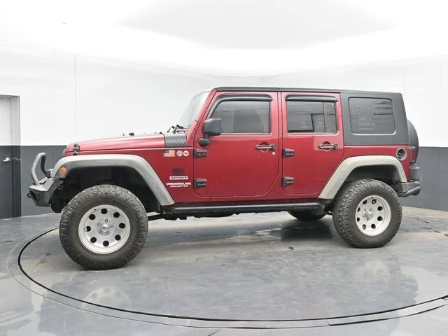 Used 2012 Red Jeep Unlimited Sport image 5