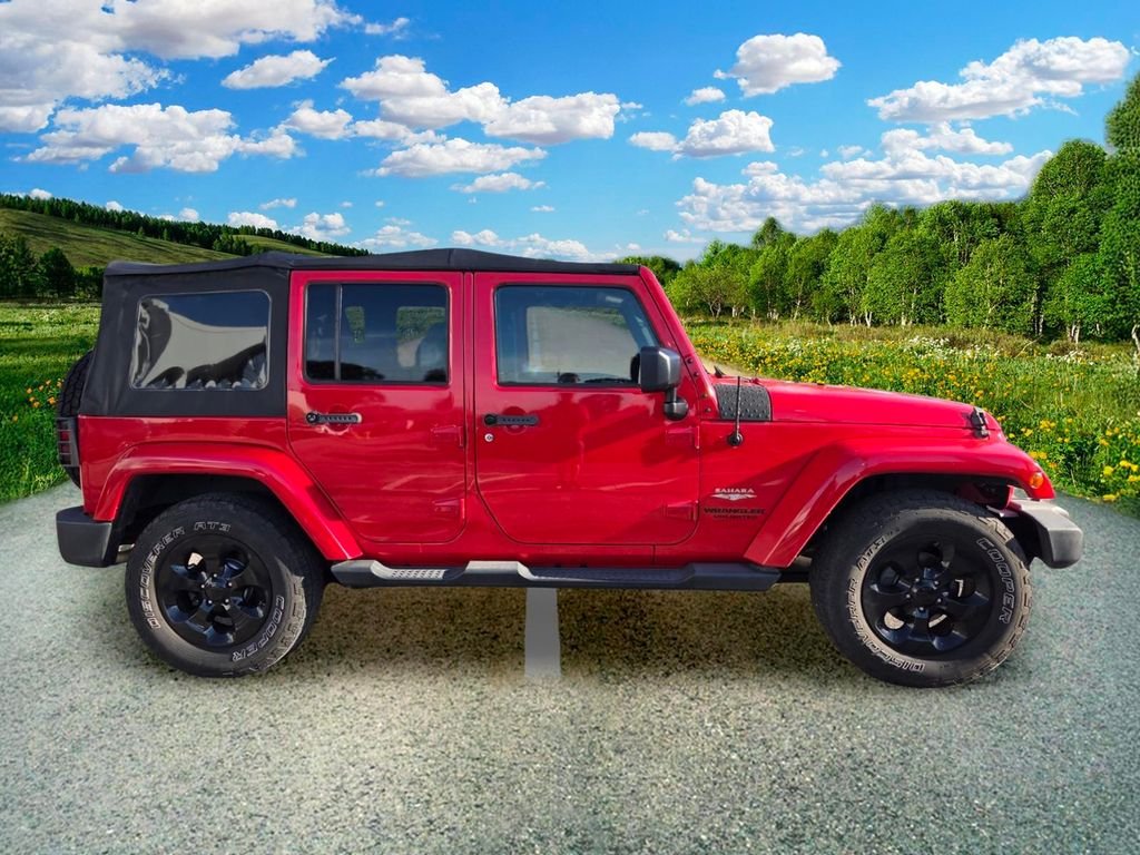 Used 2015 Red Jeep Unlimited Sahara image 7