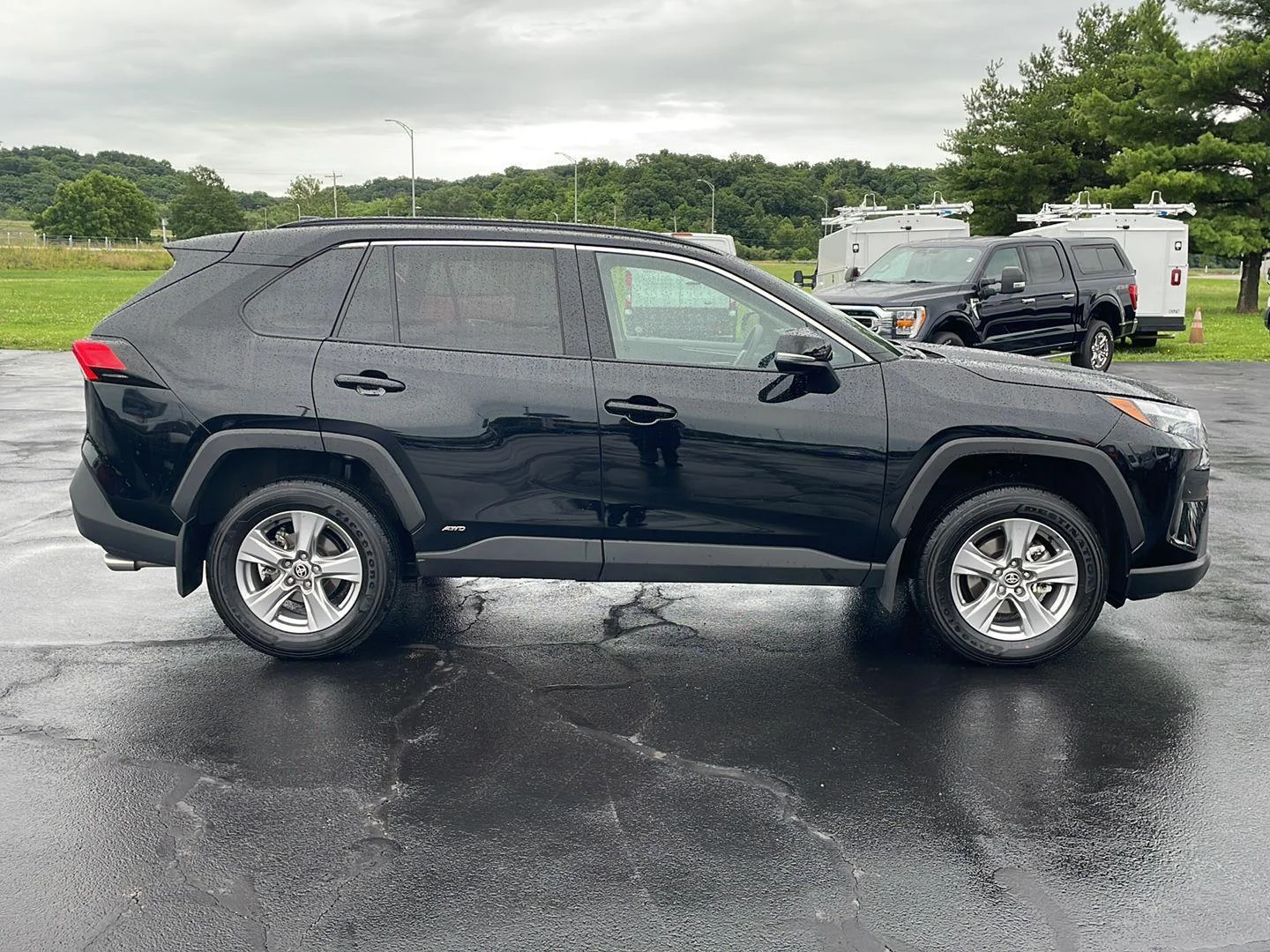 Used 2025 MIDNIGHT BLACK METALLIC TOYOTA TRUCK HYBRID XLE image 6