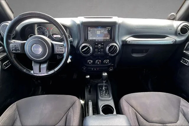 Used 2013 Black Jeep Unlimited Sport image 11