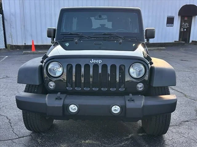 Used 2014 Black Jeep Unlimited Sport image 4