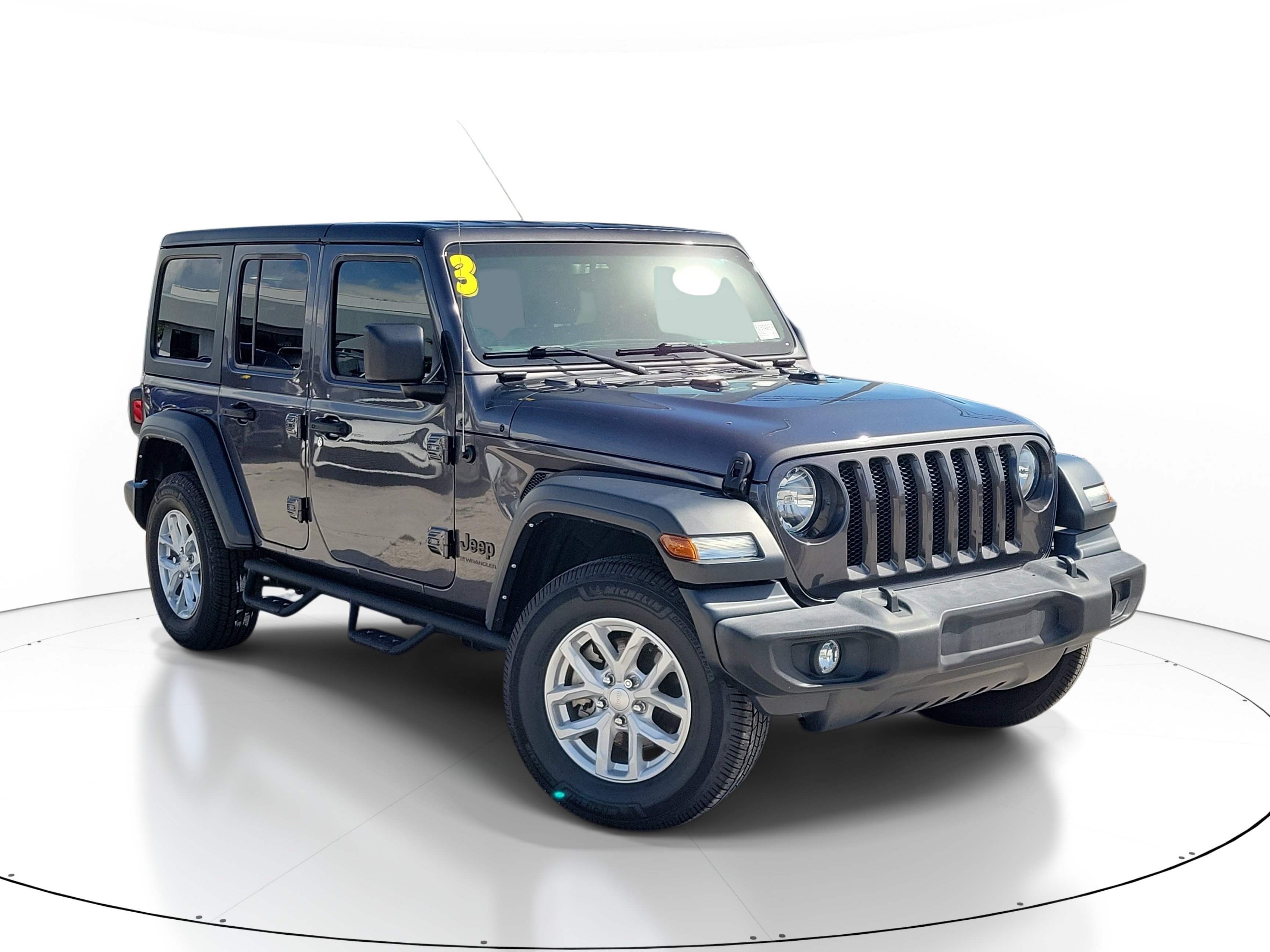 Used 2023 Granite Crystal Metallic Clearcoat Jeep Sport S image 1