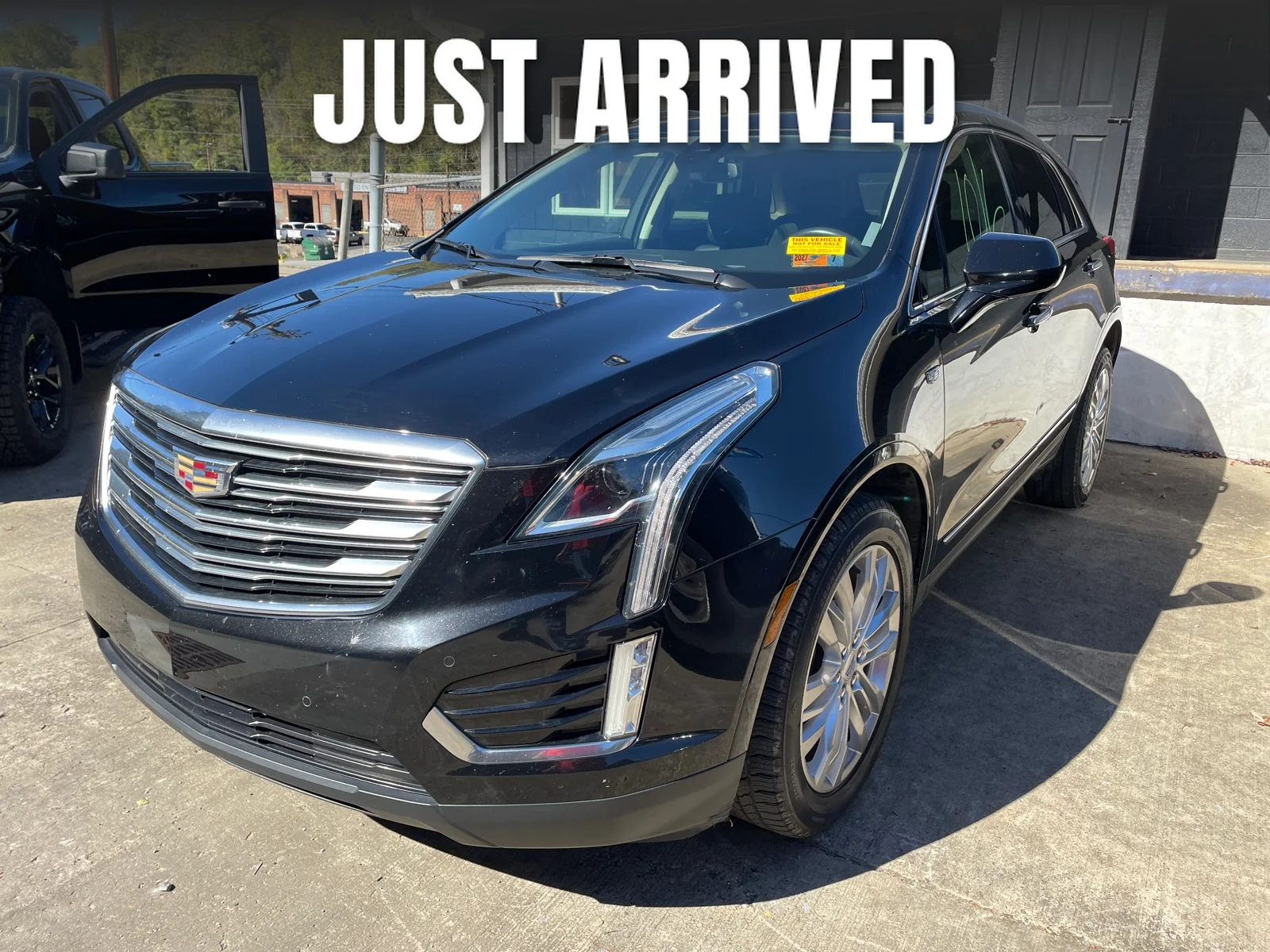 Used 2017 Stellar Black Metallic Cadillac Premium Luxury AWD image 1