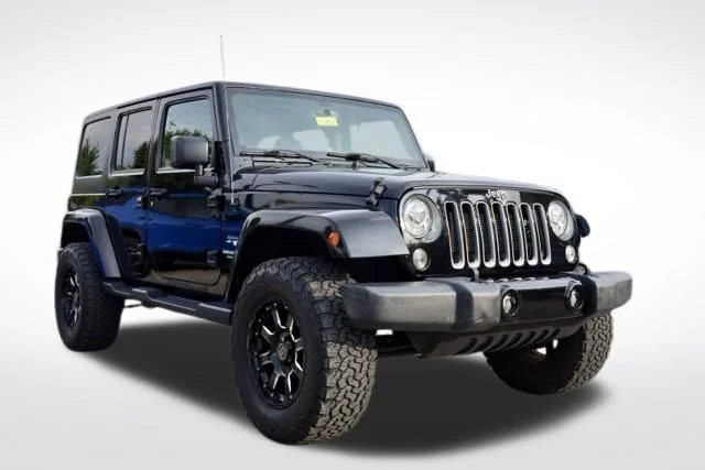 Used 2017 Black Jeep Unlimited Sahara image 1