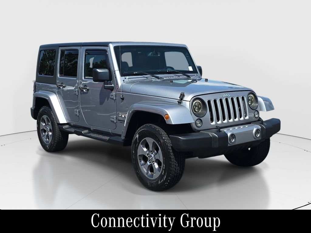 Used 2016 Silver Jeep Unlimited Sahara image 3