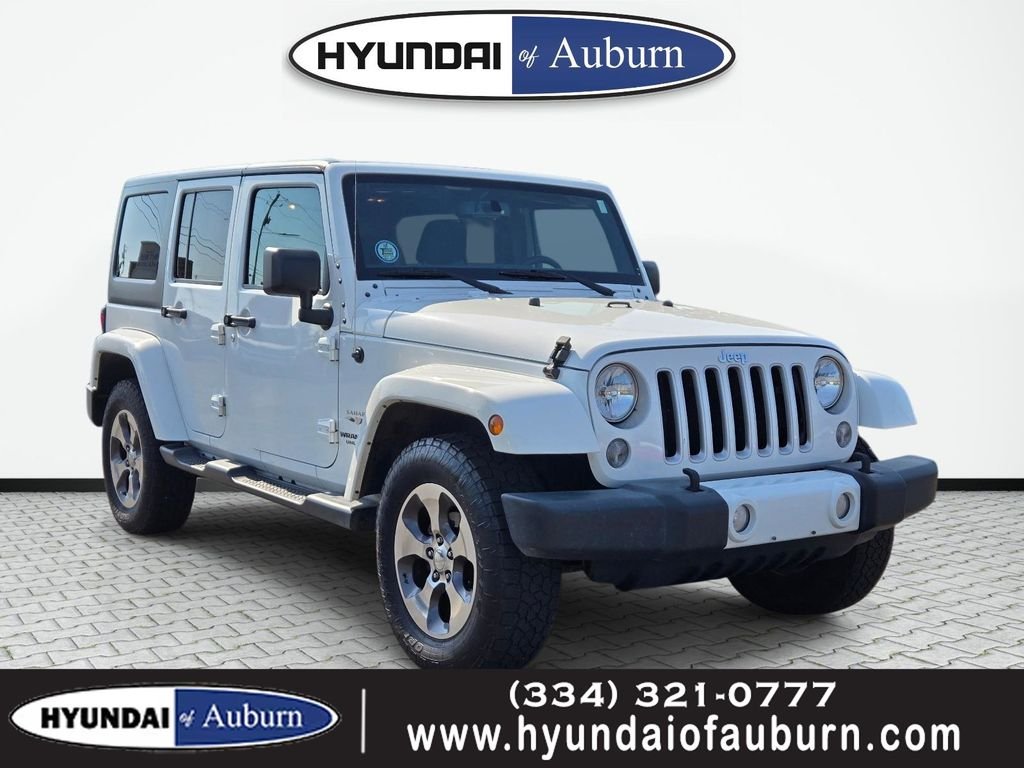 Used 2016 White Jeep Sahara image 1