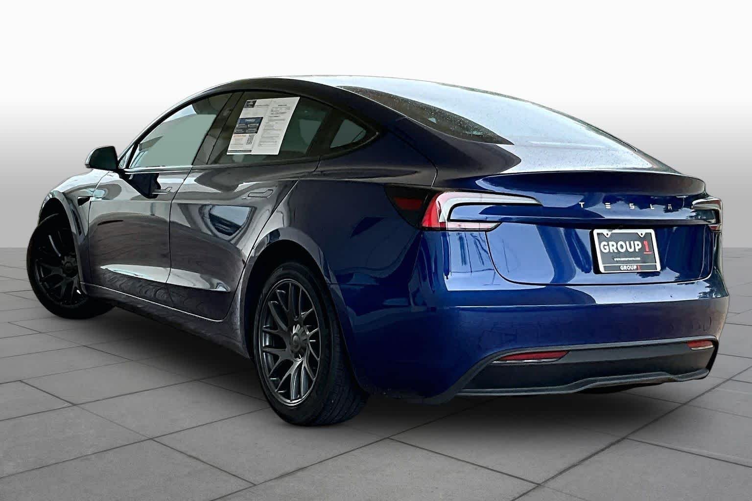 Used 2025 Solid Black Tesla Long Range image 9
