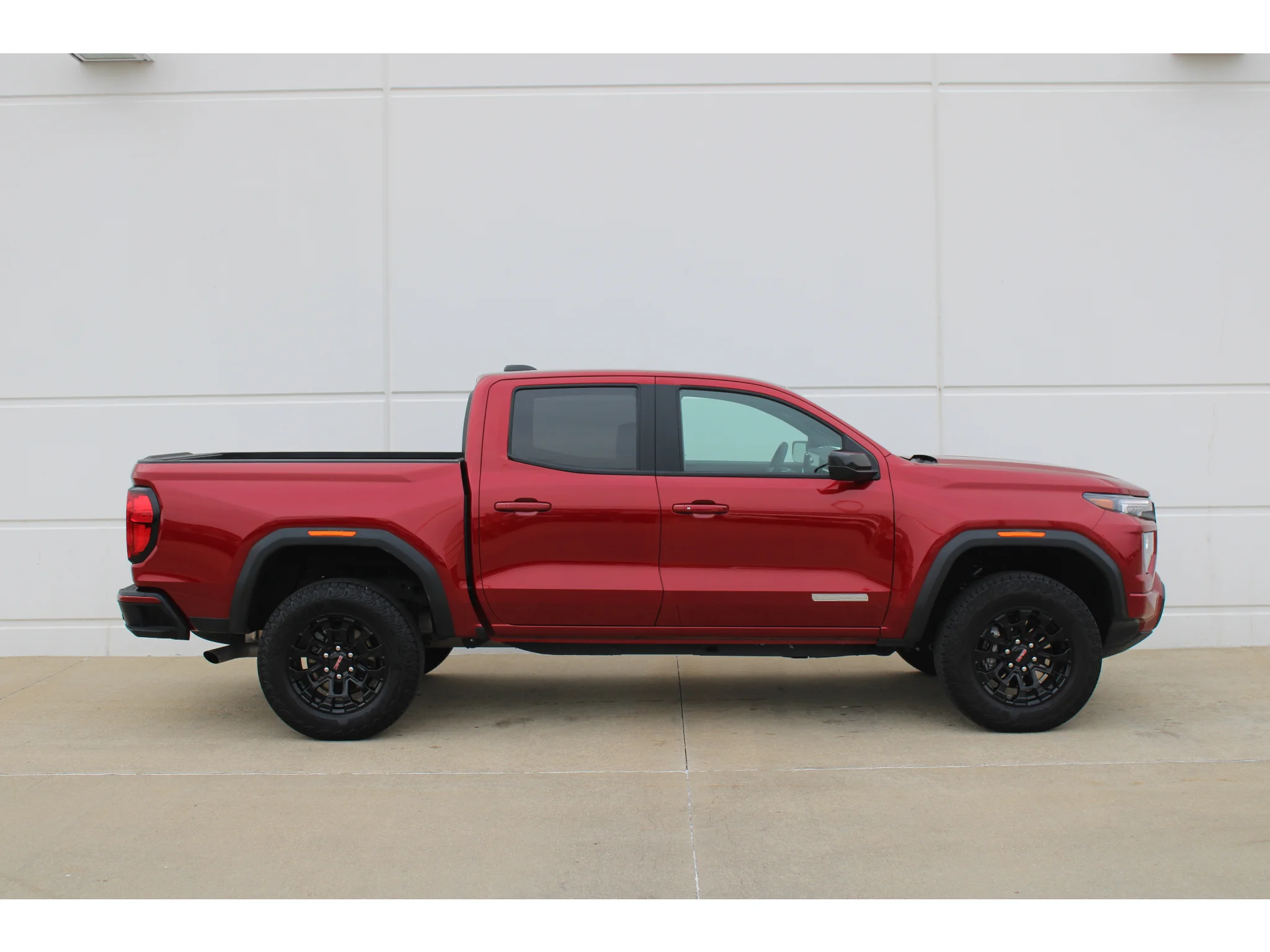 New 2026 VOLCANIC RED TINTCOAT GMC 2WD Elevation image 5