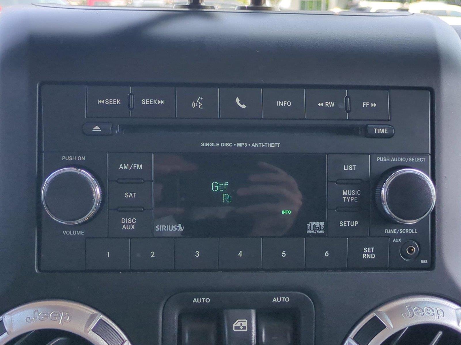 Used 2012 Black Clearcoat Jeep Sahara image 23