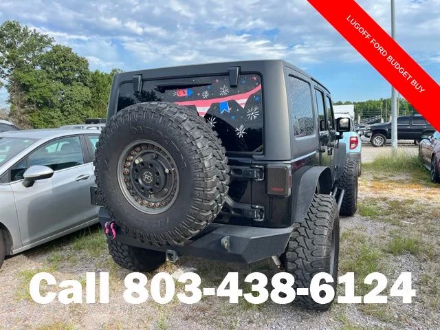 Used 2013 Black Clearcoat Jeep Unlimited Sport image 4