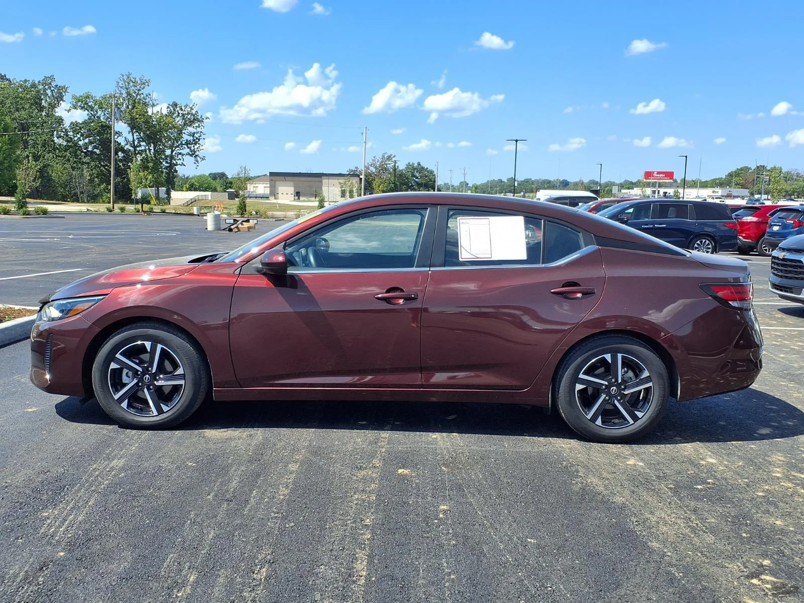 Used 2025 Rosewood Metallic Nissan SV image 16