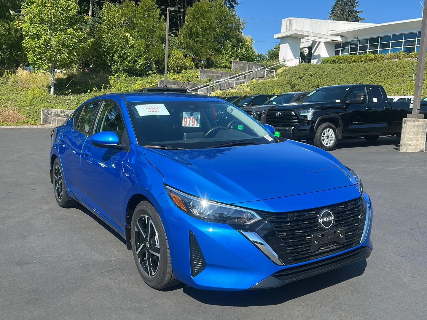 Used 2024 Electric Blue Metallic Nissan SV image 4