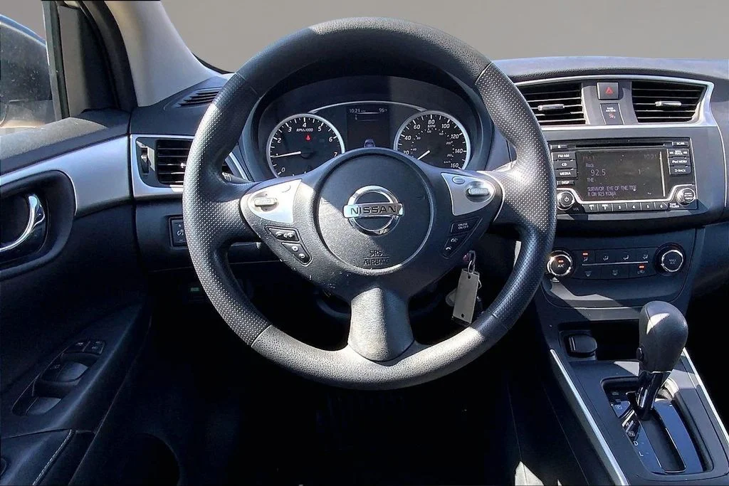 Used 2018 Brilliant Silver Metallic Nissan S image 5