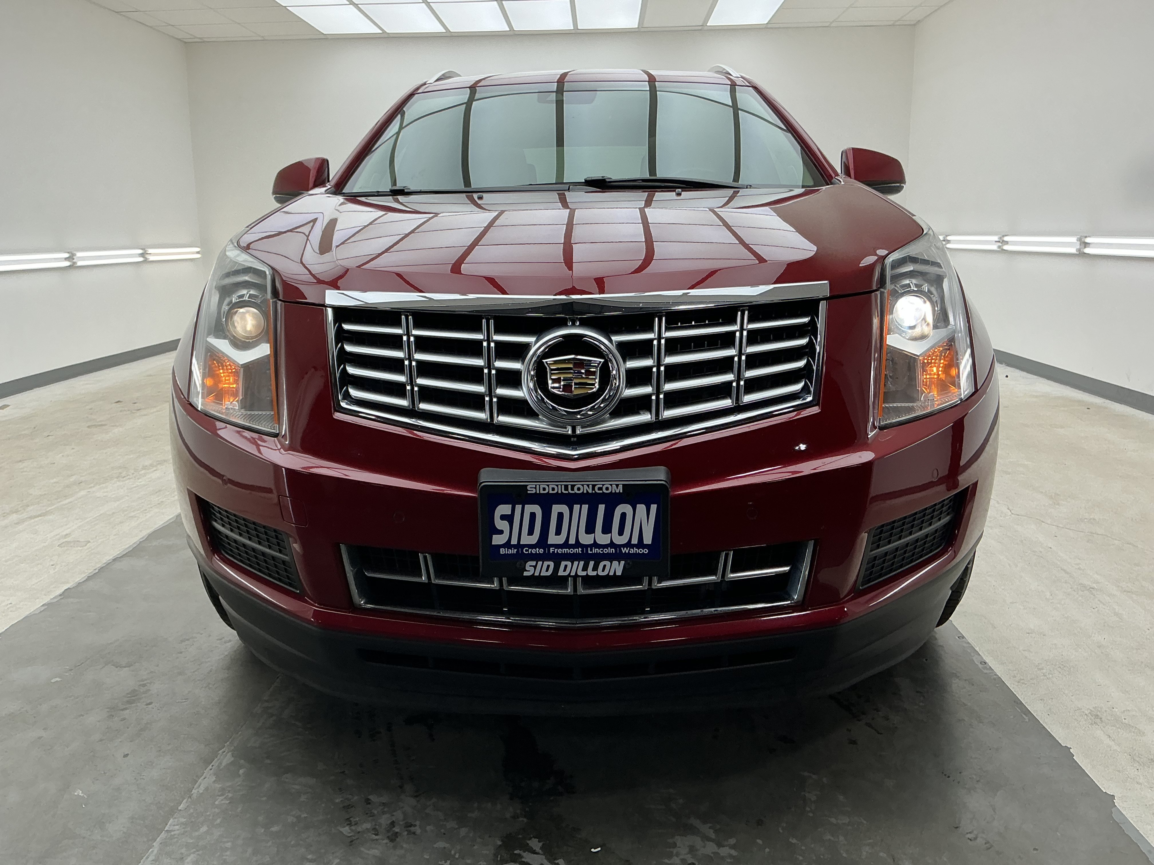 Used 2015 Crystal Red Tintcoat Cadillac Luxury Collection image 2