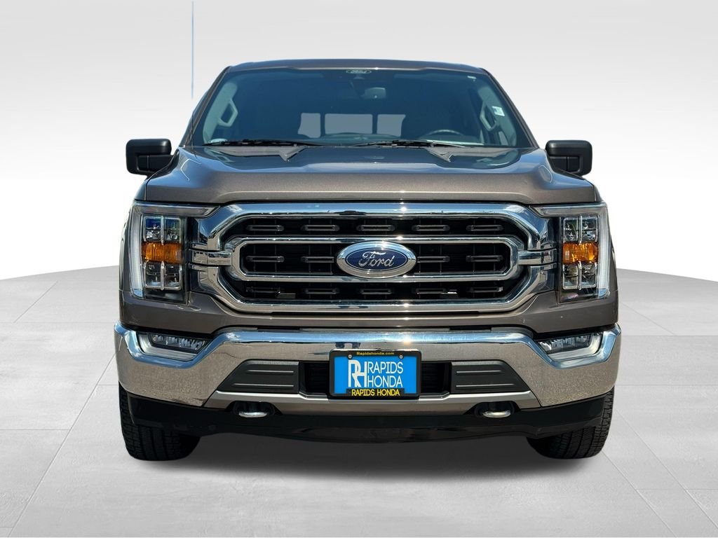 Used 2021 Ford F-150 XLT with VIN 1FTFW1E87MKD82485 for sale in Coon Rapids, Minnesota