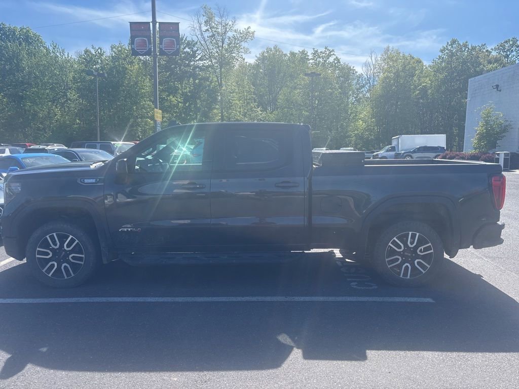 Used 2023 Titanium Rush Metallic GMC AT4 image 4