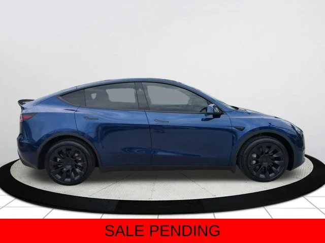 Used 2025 Tesla Model Y Long Range with VIN 7SAYGDEDXSF234963 for sale in Naples, FL