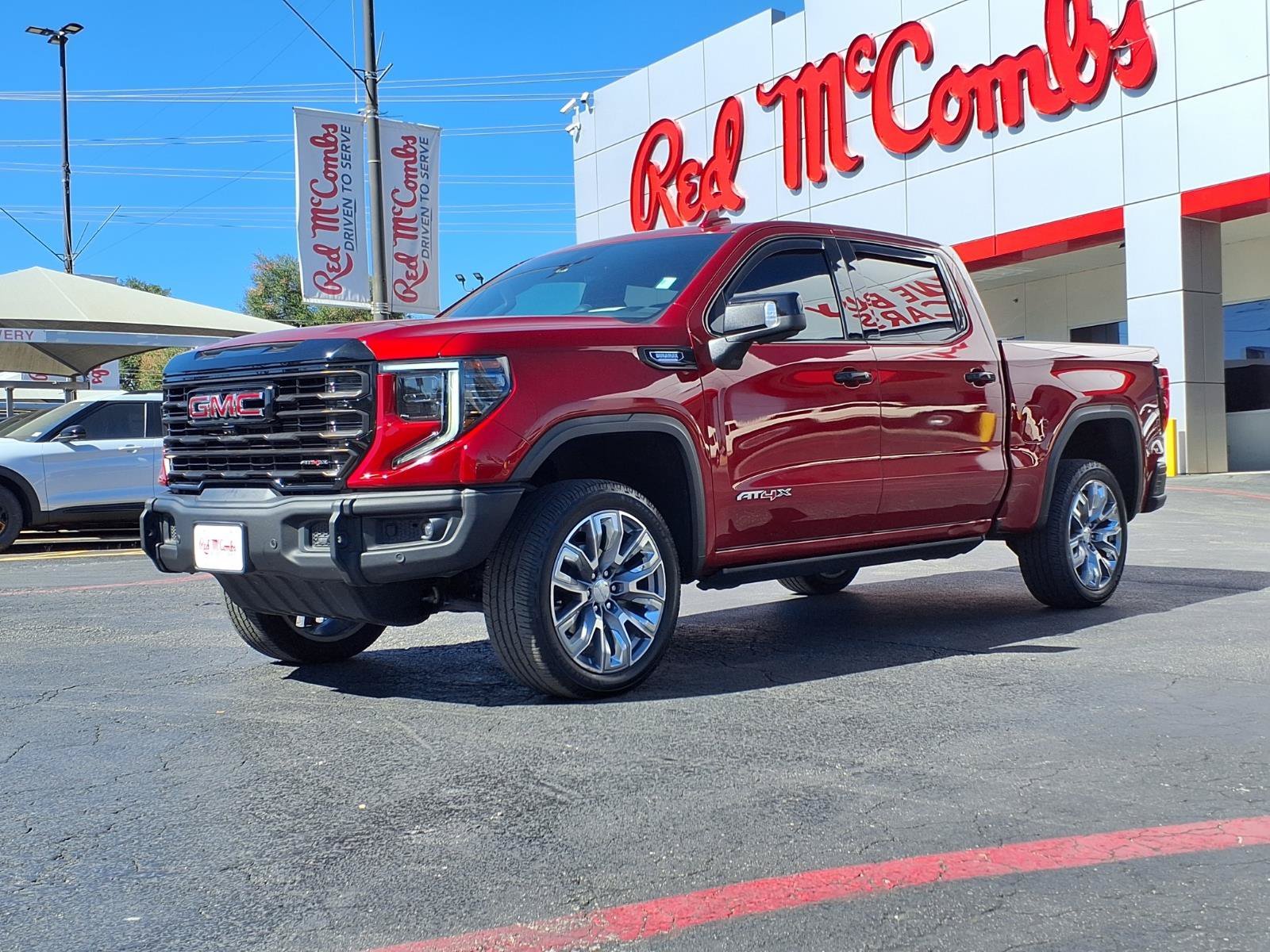 Used 2024 Volcanic Red Tintcoat GMC AT4X image 1
