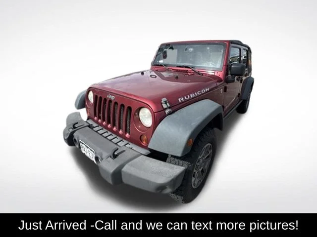 Used 2013 Red Jeep Unlimited Rubicon image 1