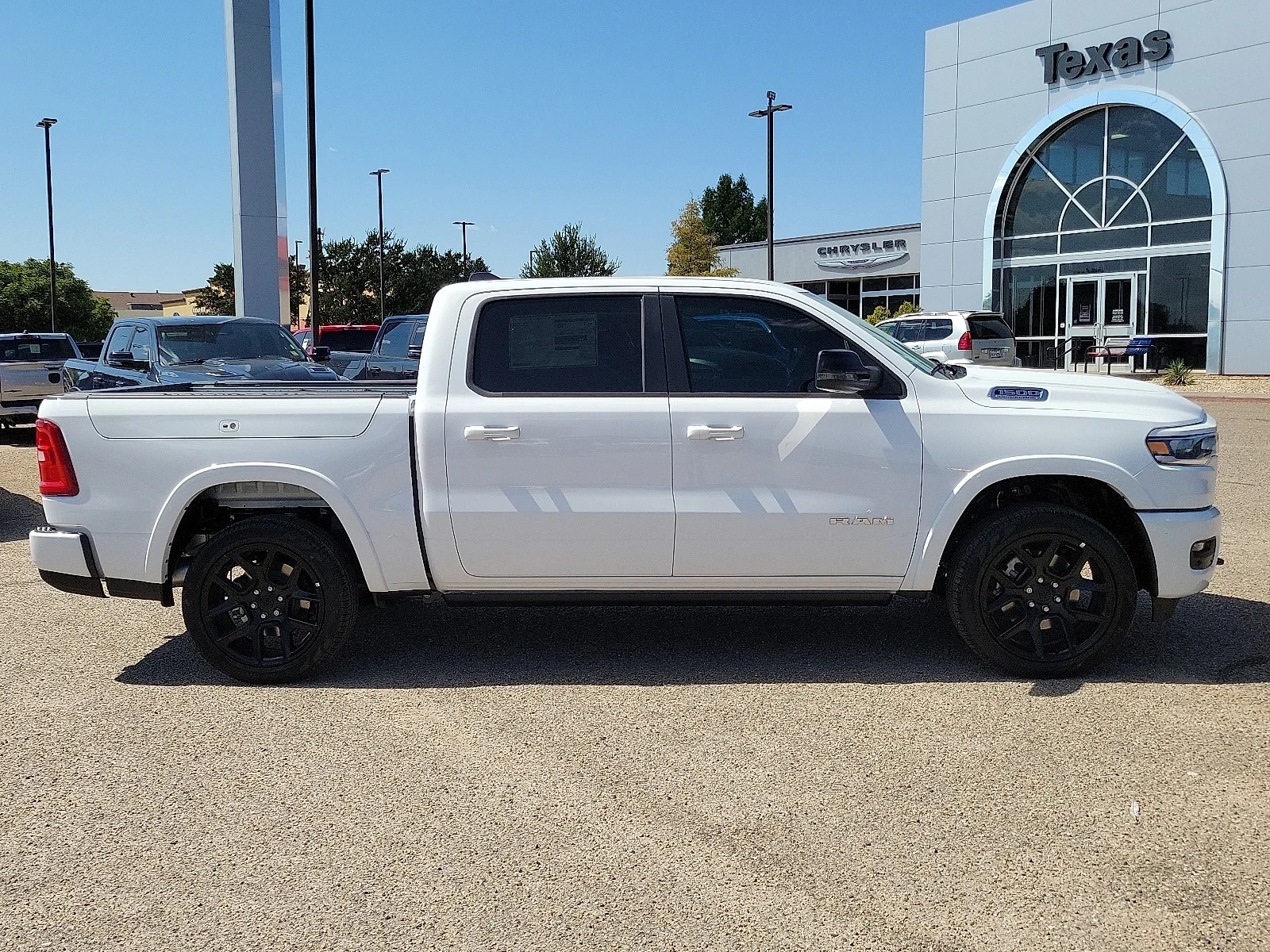 New 2026 PW7 Bright Whit Ram LARAMIE CREW CAB 4X4 5
