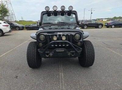Used 2014 Black Clearcoat Jeep Sahara image 5