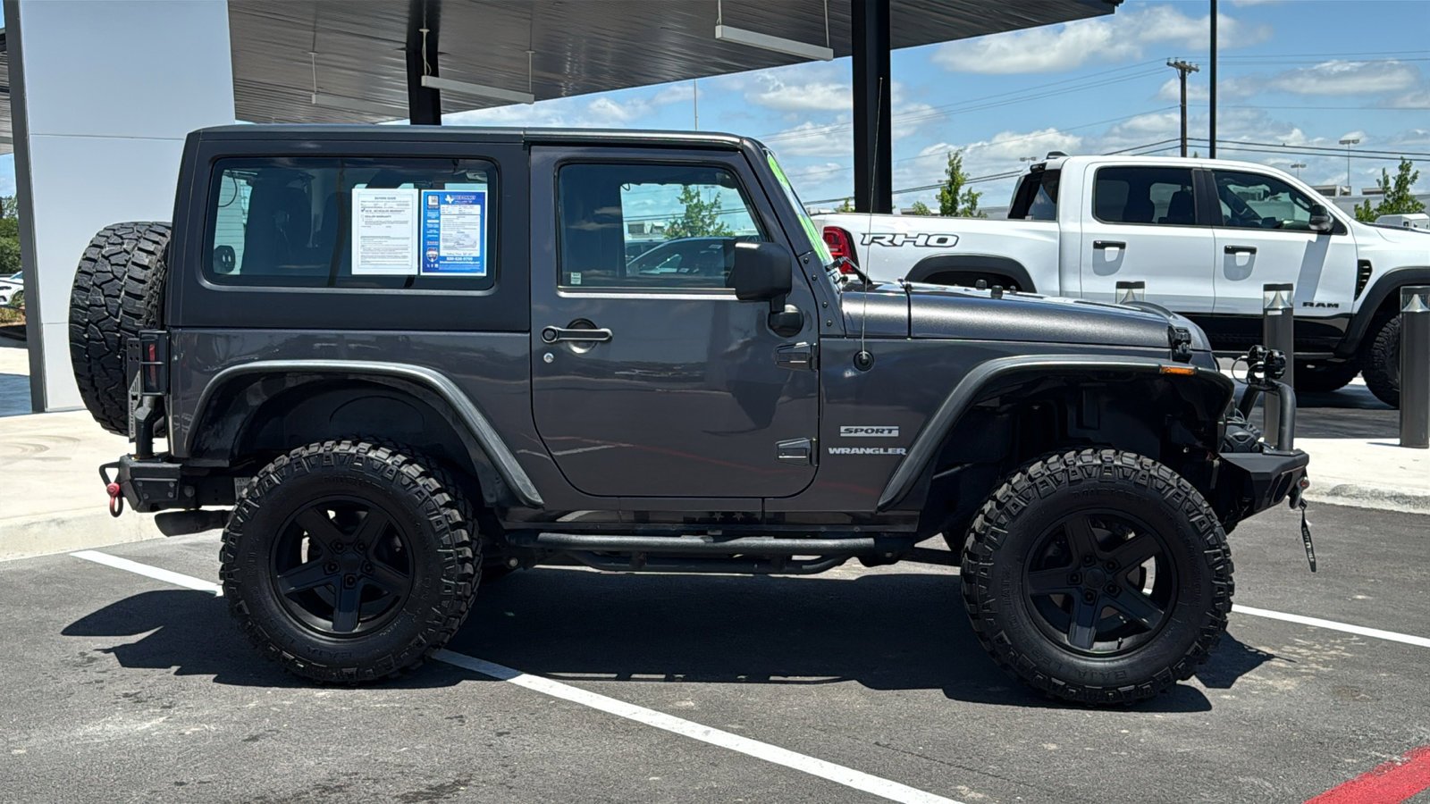 Used 2014 Granite Crystal Metallic Clearcoat Jeep Sport image 6