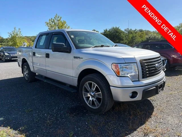 Used 2014 Ingot Silver Ford STX image 1