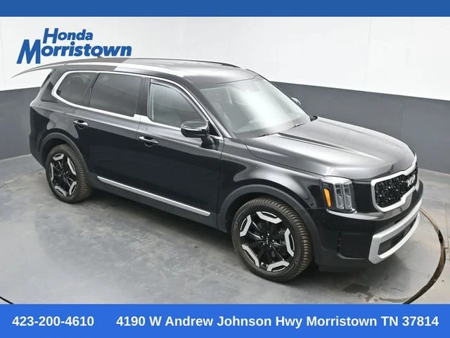 Used 2024 Ebony Black Kia EX image 1