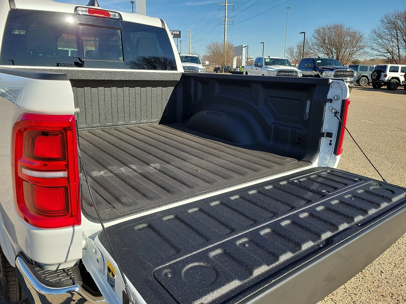 New 2026 Bright White Ram LIMITED LONGHORN CREW CAB 4X4 5