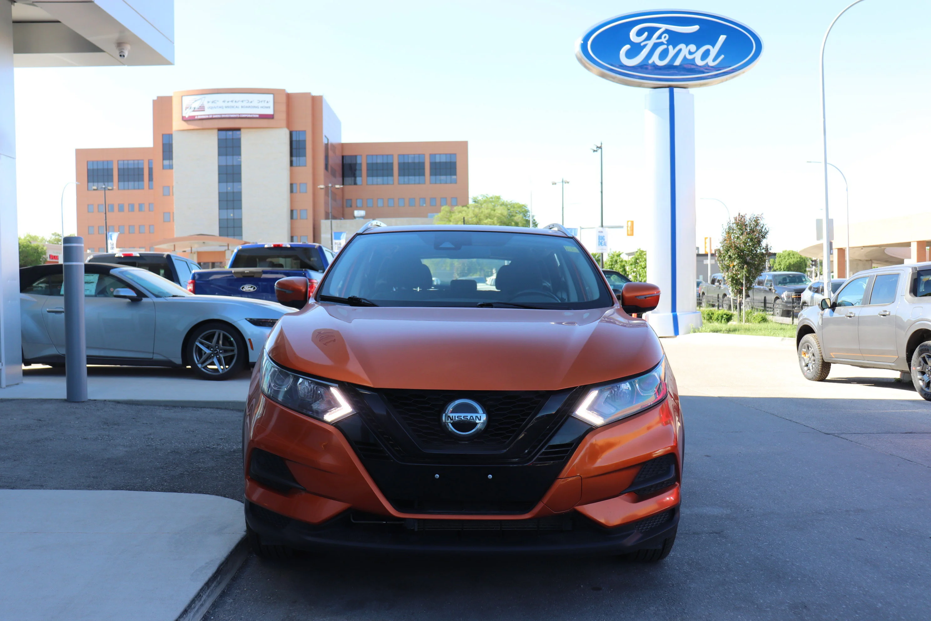 Certified Used 2022 ORANGE Nissan SV image 2