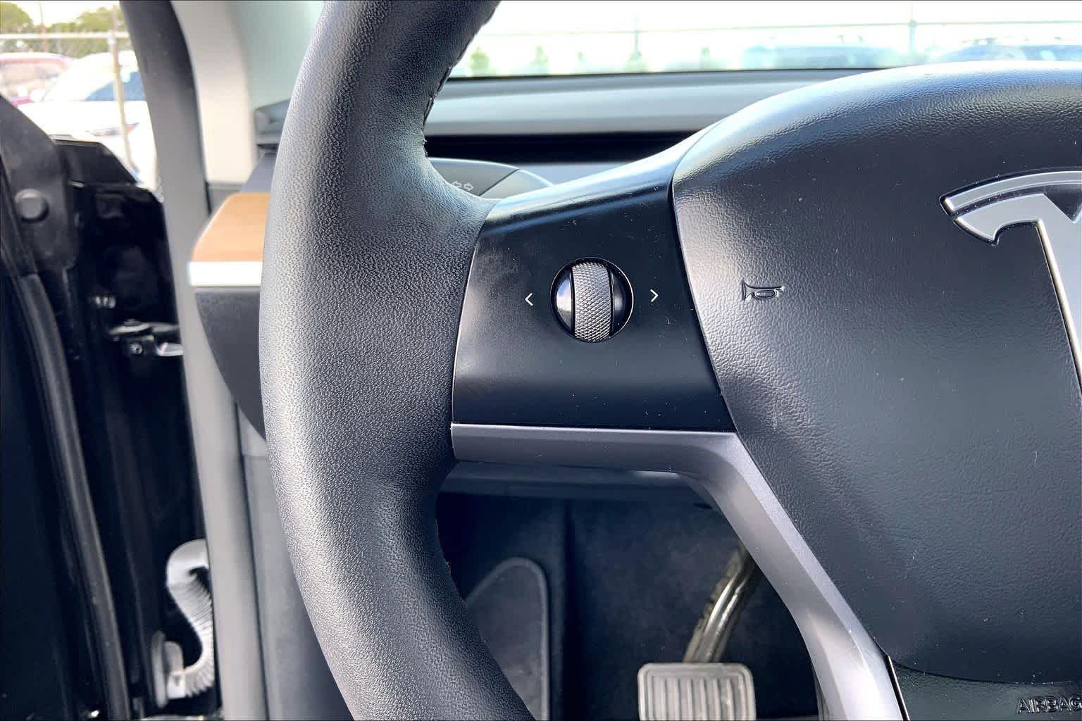 Used 2024 Solid Black Tesla  image 22