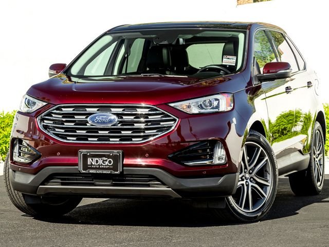 Used 2020 Burgundy Velvet Metallic Tinted Clearcoat Ford Titanium image 1