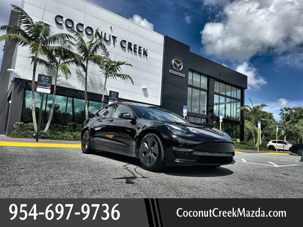 Used 2023 Solid Black Tesla  image 1