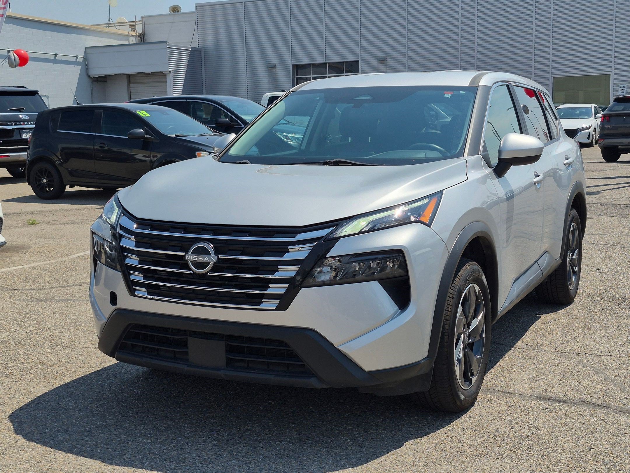 Used 2024 Brilliant Silver Metallic Nissan SV image 9